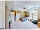Comfortable bedroom featuring a ceiling fan, large window, and ample storage space at 709 Prestige Pt, Peachtree City, GA 30269