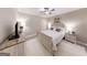 This comfortable main bedroom features a ceiling fan, wood-look floors, and bright decor at 709 Prestige Pt, Peachtree City, GA 30269