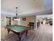 Relax in this spacious recreation room with a billiards table and entertaining area, with views to the game room at 709 Prestige Pt, Peachtree City, GA 30269