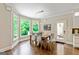 Bright dining area with views of lush greenery, modern light fixture, and stylish chairs at 709 Prestige Pt, Peachtree City, GA 30269