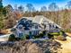 Stunning two-story stone home with a sprawling lawn and a private driveway at 709 Prestige Pt, Peachtree City, GA 30269
