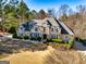 Elegant home featuring stone accents, manicured landscaping, and a grand entrance at 709 Prestige Pt, Peachtree City, GA 30269
