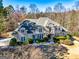 This house boasts stone accents, lush landscaping, and a manicured front lawn at 709 Prestige Pt, Peachtree City, GA 30269