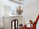 Grand foyer with elegant chandelier, high ceilings, and dark wood staircase at 709 Prestige Pt, Peachtree City, GA 30269