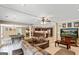 Finished basement game room featuring a wet bar, media center, ping pong table, and seating area at 709 Prestige Pt, Peachtree City, GA 30269
