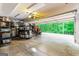 Spacious garage with ample storage and an open door to the outdoors at 709 Prestige Pt, Peachtree City, GA 30269