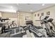 Home gym equipped with weight machines, cardio equipment, and free weights at 709 Prestige Pt, Peachtree City, GA 30269