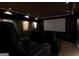A cozy home theater features comfortable seating, a large screen, and recessed lighting at 709 Prestige Pt, Peachtree City, GA 30269