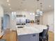 Well-lit kitchen with pendant lighting, large island, and stainless steel appliances at 709 Prestige Pt, Peachtree City, GA 30269