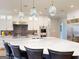 Beautiful kitchen with white cabinetry, marble countertops, and stainless-steel appliances at 709 Prestige Pt, Peachtree City, GA 30269