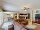 Spacious living room leading to recreation room and kitchen area creates an open and inviting space at 709 Prestige Pt, Peachtree City, GA 30269
