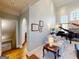 Bright living room featuring a baby grand piano, large arched windows, and access to a staircase at 709 Prestige Pt, Peachtree City, GA 30269