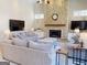 Inviting living room with a stone fireplace and neutral decor at 709 Prestige Pt, Peachtree City, GA 30269