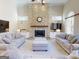 Inviting living room with a stone fireplace and neutral decor at 709 Prestige Pt, Peachtree City, GA 30269
