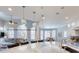 Open living space with kitchen, dining area, and living room filled with natural light at 709 Prestige Pt, Peachtree City, GA 30269