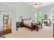 Expansive main bedroom with fireplace, sitting area, and arched windows offering lots of natural light at 709 Prestige Pt, Peachtree City, GA 30269