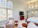 Spacious main bedroom featuring a sitting area with large windows and natural light at 709 Prestige Pt, Peachtree City, GA 30269