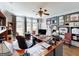 Executive office with built-in shelves and multiple workstations, creating a functional workspace at 709 Prestige Pt, Peachtree City, GA 30269