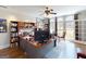 Well-lit home office with large windows and custom cabinetry, perfect for productivity at 709 Prestige Pt, Peachtree City, GA 30269