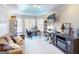 Bright home office featuring custom tray ceiling, large windows, built-in shelving, and stylish decor at 709 Prestige Pt, Peachtree City, GA 30269