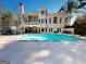 An expansive backyard pool area with home exterior backdrop, ideal for entertaining and enjoying the outdoors at 709 Prestige Pt, Peachtree City, GA 30269