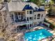 Stunning rear exterior featuring a walkout deck, patio and private pool at 709 Prestige Pt, Peachtree City, GA 30269