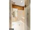 Contemporary shower showcasing glass doors, seating, and tile surround, with a view to the soaking tub at 709 Prestige Pt, Peachtree City, GA 30269