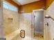 Shower stall featuring a built-in bench and gold-colored fixtures at 709 Prestige Pt, Peachtree City, GA 30269