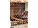 Close up of a stainless steel stove top with a unique tiled backsplash at 709 Prestige Pt, Peachtree City, GA 30269