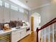 Modern wet bar with white cabinetry, marble countertops, a wine cooler, and mosaic backsplash at 709 Prestige Pt, Peachtree City, GA 30269