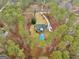 Overhead shot of a beautiful home with pool nestled amongst lush greenery, featuring a long driveway at 185 Lady Helen Ct, Fayetteville, GA 30214