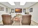 Finished basement with two leather armchairs, a table, and a flat screen TV at 185 Lady Helen Ct, Fayetteville, GA 30214