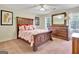 Bedroom featuring a queen size bed, dresser, and window with great natural light at 185 Lady Helen Ct, Fayetteville, GA 30214