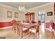 Formal dining room featuring beautiful chandelier and wainscoting throughout at 185 Lady Helen Ct, Fayetteville, GA 30214