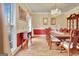 Formal dining room with large windows, chandelier, and elegant furnishings at 185 Lady Helen Ct, Fayetteville, GA 30214