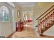 Inviting foyer features hardwood floors, staircase, and decorative accents at 185 Lady Helen Ct, Fayetteville, GA 30214