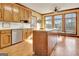 Kitchen area featuring wood cabinets, white countertops, and a center island with bar seating at 185 Lady Helen Ct, Fayetteville, GA 30214