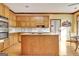 Kitchen with wood cabinets, a central island and stainless steel double ovens at 185 Lady Helen Ct, Fayetteville, GA 30214