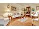 Bright living room with hardwood floors, white furniture, and classic decor at 185 Lady Helen Ct, Fayetteville, GA 30214