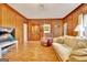 Wood-paneled living room with a cozy recliner, and a wet bar at 185 Lady Helen Ct, Fayetteville, GA 30214