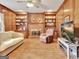 Cozy living room featuring a fireplace, built-in shelving, and a comfortable sofa at 185 Lady Helen Ct, Fayetteville, GA 30214