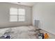 Bedroom with a large window offering natural light at 3623 Meadow Glen Cir, Ellenwood, GA 30294