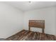 Empty bedroom showing wood-look flooring and a headboard in an otherwise unfurnished space at 3623 Meadow Glen Cir, Ellenwood, GA 30294