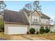 Charming two-story home with an attached two-car garage and well-manicured landscaping at 3623 Meadow Glen Cir, Ellenwood, GA 30294