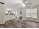 View of a living space with an open layout, wood-look flooring, and natural light at 3623 Meadow Glen Cir, Ellenwood, GA 30294