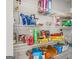 Organized pantry with wire shelves stocked with a variety of food and household items at 3623 Meadow Glen Cir, Ellenwood, GA 30294