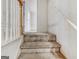 Carpeted staircase with white walls needing repair at 3623 Meadow Glen Cir, Ellenwood, GA 30294