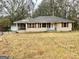 Charming single-story home with red shutters, screened in porch, and front yard at 733 Linda Way, Forest Park, GA 30297