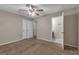 An inviting bedroom with an open doorway to an adjoining room features neutral walls and plush carpeting at 949 Rock Oak Ln, Lawrenceville, GA 30046