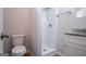 Bathroom featuring a shower, toilet, white walls, and modern fixtures at 3049 Flat Shoals Rd, Atlanta, GA 30349